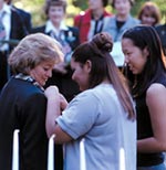 Photo of Senior Girl Scouts pinning an adult.