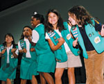 Photo of Junior Girl Scouts clapping to music. © GSUSA. All rights reserved.