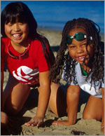 Photo of two younger Girl Scouts on the beach. © GSUSA. All rights reserved. (Photographer: Lori Adamski-Peek)