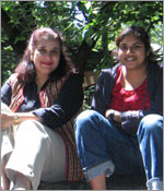 Photo of two Girl Scouts sitting outside. � GSUSA. All rights reserved.
