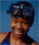 Photo of a girl with swim goggles. &copy; GSUSA. All rights reserved.