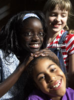 Photo of three Girl Scouts. &copy; GSUSA. All rights reserved. (Photographer: Quad Photo/Karineh Gurjian-Angelo/Dedjora Von Jutaz)