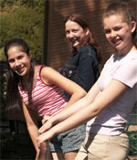 Photo of girls standing at balcony outdoors. &copy; GSUSA. All rights reserved. (Photographer: Quad Photo/Karineh Gurjian-Angelo/Dedjora Von Jutaz)