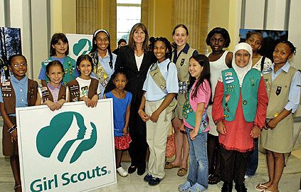 Photo of Juliette Gordon Low posing with some of the nation's first Girl Scouts. © GSUSA. All rights reserved.