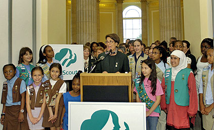 Photo of Juliette Gordon Low posing with some of the nation's first Girl Scouts. © GSUSA. All rights reserved.