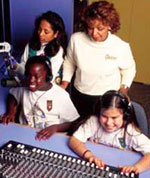 Photo of Girl Scouts using an audiometer.