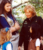 Photo of Kathy Cloninger with three Girl Scouts. &copy; GSUSA. All rights reserved.