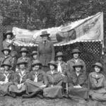 Photo of Juliette Gordon Low with Girl Scouts in 1922. &copy; GSUSA. All rights reserved.
