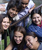 Photo of Girl Scouts sitting on steps outdoors. &copy; GSUSA. All rights reserved.