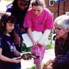 Photo of girls examining a mushroom in the From Sidewalks to Treetops program. © GSUSA. All rights reserved.