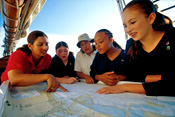 Photo of girls reading a map