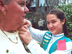 Photo of a Junior Girl Scout taking part in a Girl Scouts' Own and Pinning Ceremony. &copy; GSUSA. All rights reserved.