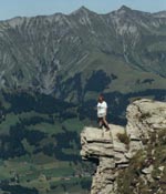 Photo of a girl standing on a cliff. (Photo courtesy of WAGGGS)