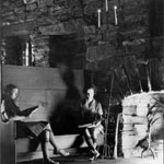 Photo of girls studying by the fireplace at Great Hall, circa 1940. &copy; GSUSA. All rights reserved.