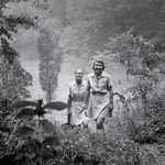 Photo of two women hiking on the Macy grounds, circa 1949-1958. &copy; GSUSA. All rights reserved.