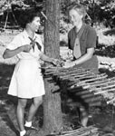 Photo of two women primitive-camping in the Dell, circa 1950s. &copy; GSUSA. All rights reserved.