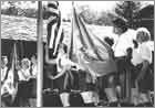 Photo of the first rising of the Macy flag (1964). © GSUSA. All rights reserved.