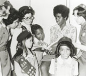 Photo of Girl Scout president Gloria Scott with Girl Scouts. © GSUSA. All rights reserved.