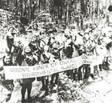 Photo of Girl Scouts holding national environmental award banner. © GSUSA. All rights reserved.