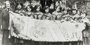 Photo of Juliette Gordon Low posing with some of the nation's first Girl Scouts. © GSUSA. All rights reserved.