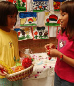 Photo of two Hispanic girls talking. &copy; GSUSA. All rights reserved.