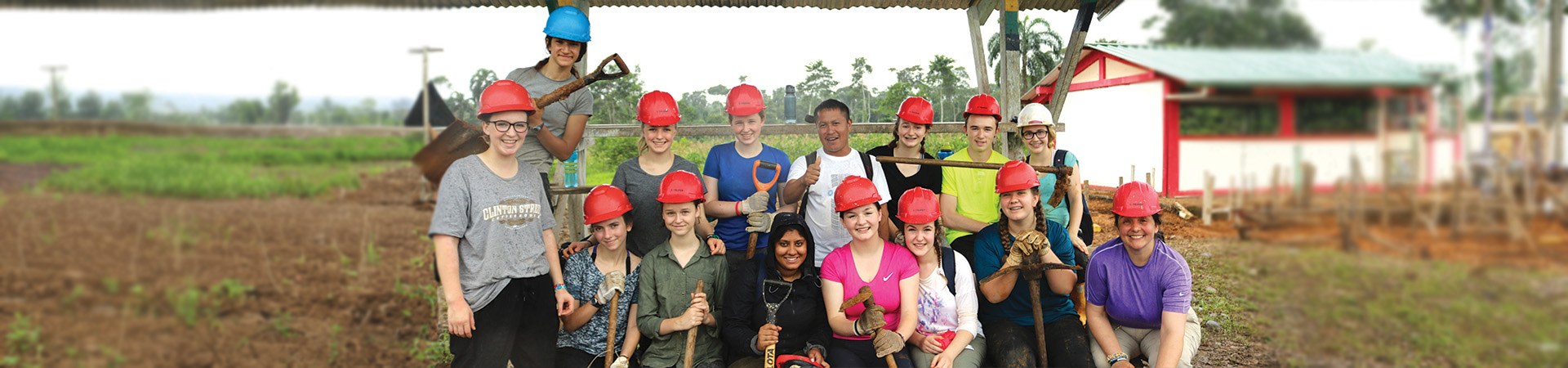  Troop 45065 poses wearing hard hats and holding various tools 