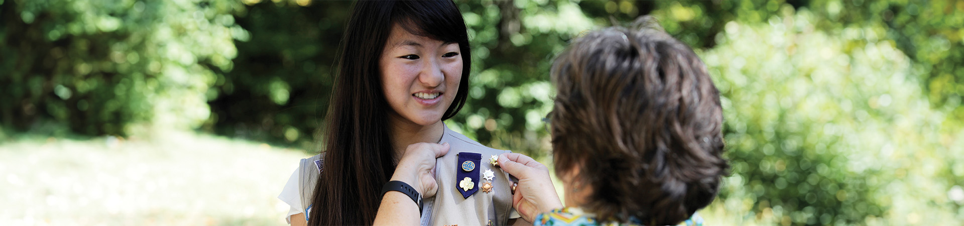  A Girl Scout receives her Gold Award. 