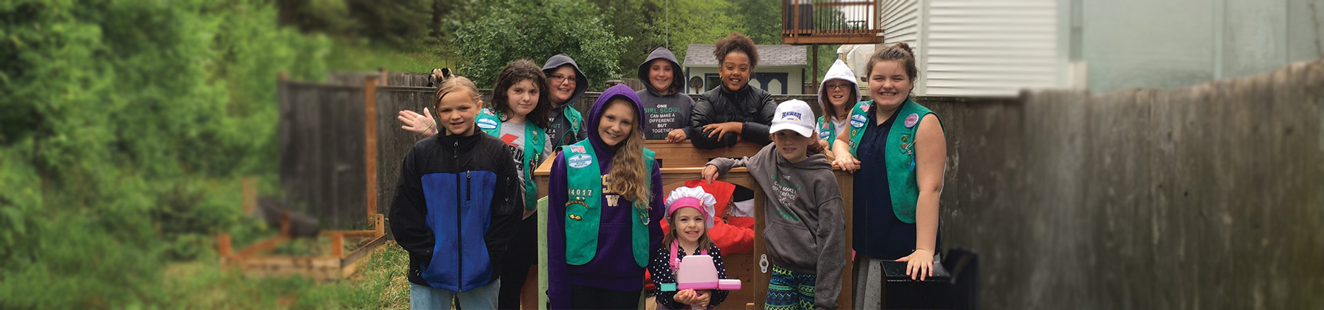  Girl Scout Troop 44017 and Hannah Mae show off their playhouse-in-the-making.  