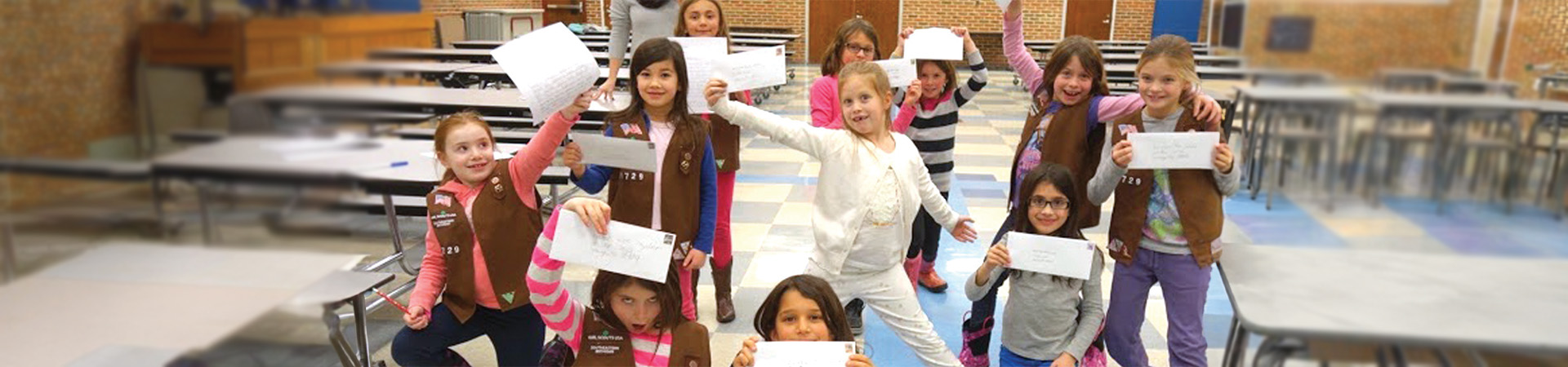   Girl Scout Brownies show off their advocacy letters to Michigan Governor Rick Snyder. 